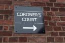 A coroner’s court sign.