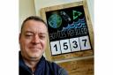 Steven Wilde, owner of The Pantry in Stocksfield, next to the board showing how many bottles he has refilled since the start of 2022