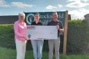 (L-R) Lynne Graham, Maud from Children's Cancer North, and Stocksfield Golf Club captain Marty Wilkinson