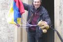 Revd Tom Birch with a teddy and parachute