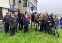 Champ Royal with trainer Susan Corbett (front centre) and owners The Northern Racing Club braving the rain in the winners' enclosure
