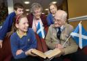 Highfield Middle School pupils, Guy Bloomer and Ruby Smith with resident Eileen Dobbing (back) and Poppy Armstrong with resident Eric Lewin (front)