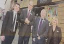 Beales store manager Eric Liddle (L) and deputy store manager Sian Rylands welcome group chief executive Michael Hitchcock and trading director Tony Richards to Hexham in 2014