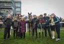 Pinot Rouge (Edward Austin) and some happy connections after landing a listed mares hurdle at Doncaster