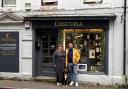 Obscuria owners Laura and Steven Brownsteele with shop dog Penny outside the business on Market Street in Hexham
