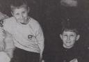 Hexham 1st beaver Sean Irving and cub scout Kieran Irving take a break from sorting donations for Kosovon refugees in 1999