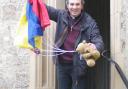 Revd Tom Birch with a teddy and parachute