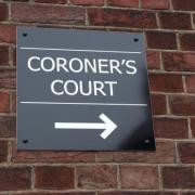 A coroner’s court sign.