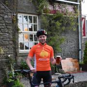 Michael enjoying a pint after charity challenge