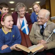 Highfield Middle School pupils, Guy Bloomer and Ruby Smith with resident Eileen Dobbing (back) and Poppy Armstrong with resident Eric Lewin (front)