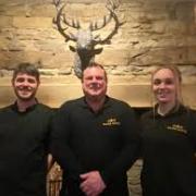 Terry Christie with the Manor Inn staff, Manager Ashlyn Harrison and Head chef, Matthew Jones