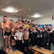 A jubilant Ponteland United squad and managment team celebrating in the dresssing room after clinching a place in the semi-finals of the Northumberland FA Benevolent Bowl