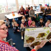 Hexham First School enjoy story time with parents for World Book Day.