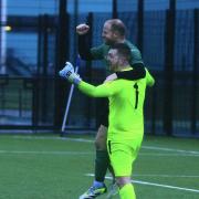 Wallington legend John Paxton celebrates with keeper Aaron Carr after scoring the winning penalty in the Northumberland FA Benevolent Bowl semi-final against Ponteland United