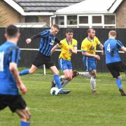 Ryton & Crawcrook Albion centre forward Aaron Costello beats two defenders before firing home his 30th league goal of the season