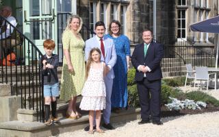 (L-R) Daniel Harrison and family, Reverend Rachel Scheffer (blue dress) and Matfen Hall Hotel and Spa commercial director, James O’Donnell