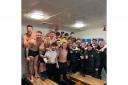 A jubilant Ponteland United squad and managment team celebrating in the dresssing room after clinching a place in the semi-finals of the Northumberland FA Benevolent Bowl
