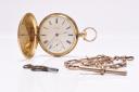 A Robert Roskells 18 carat gold hunter pocket watch which sold for £1,350.