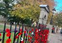 The gates to Hexham's Sele Park decorated with poppies