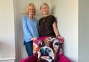 Jayne Dodds and Sue Moffitt pictured with the chair Jayne upholstered in summer