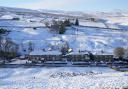 Undated picture of snow-covered fields and rooftops in Allenheads in Northumberland.