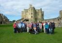 Hexham Town Twinning Association in 2017 when they hosted a successful visit from their German twin town, Metzingen. Town twinning members are pictured with their German visitors during a visit to Warkworth Castle.