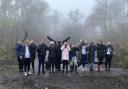 Liz Heard, Northumberland Wildlife Trust Eco Mentor and local school children test out binoculars during a trip to the Rising Sun Country Park