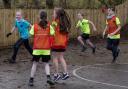Henshaw Primary School pupils playing football in their new kits