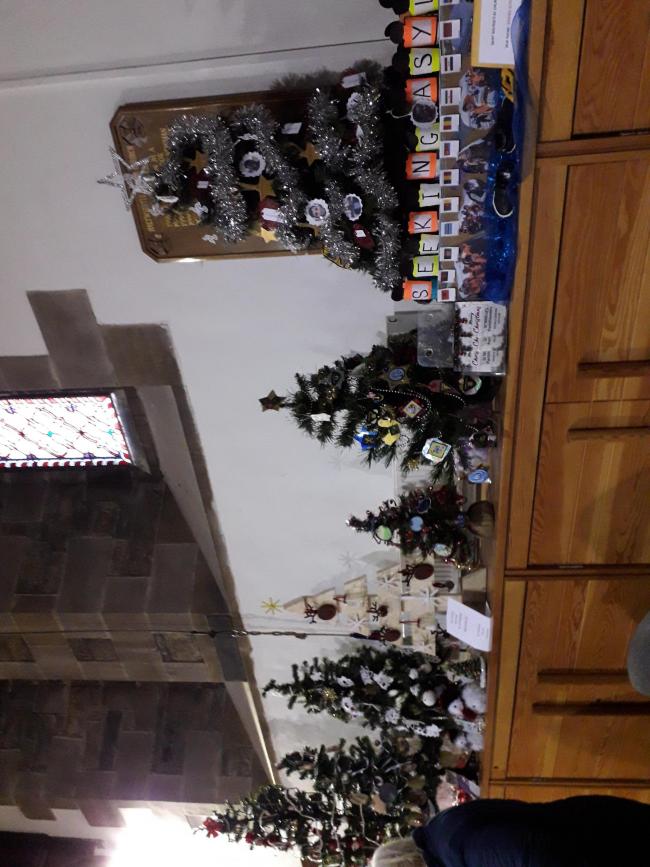 TREE-MENDOUS: Some of the Christmas trees decorated and donated to Halthwhistle Christmas Tree Festival