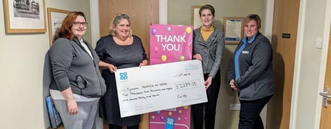 CHEQUE: Co-op member pioneer for Haltwhistle and Haydon Bridge Rachel Duffy, Anne Donelly, funeral arranger of Co-op Haltwhistle Funeral Care, and Co-op team leader Carla Robinson presented the final cheque to Charlotte Pearson, head of income generation
