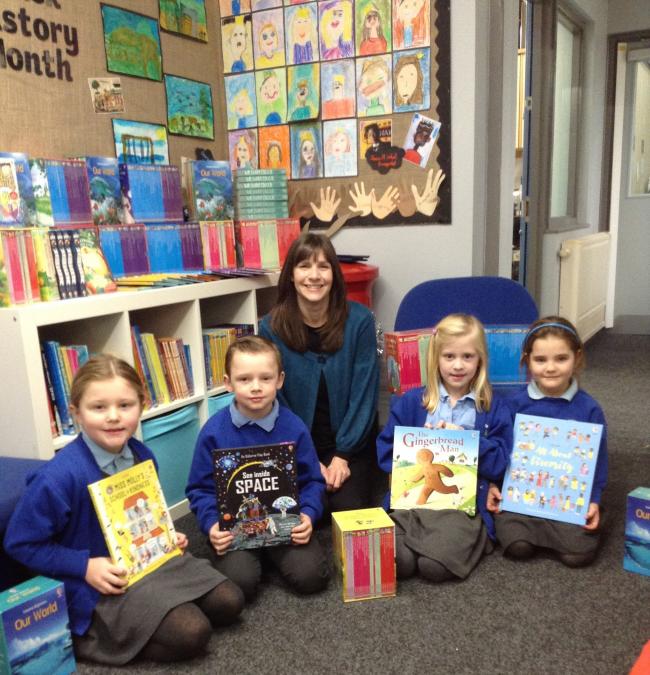 BOOKWORMS: Acomb First School pupils happy to recieve new books with with Karen Ewen, an Independent Usborne Partner. 