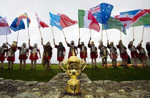 Hexham Courant: COMPETITION: The Ermine Street Guard Roman Reenactment Society fly the flags of 20 nations participating in the Rugby World Cup in 2015. Image: Hannah McKay