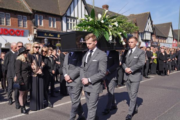 Hexham Courant: The coffin of The Wanted star Tom Parker is carried ahead of his funeral. (PA)