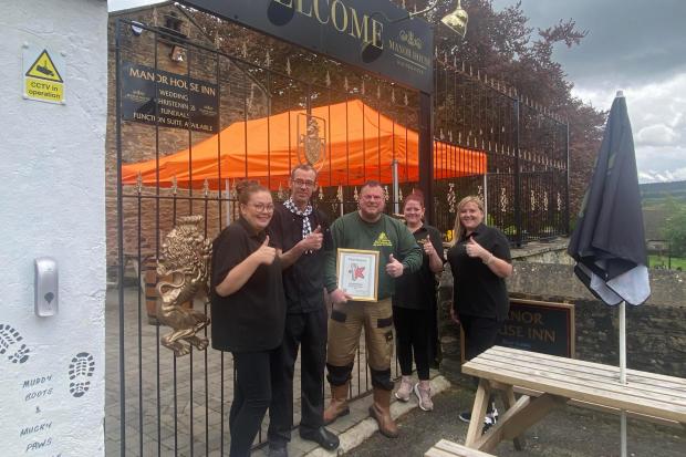 TEAM: Manor House staff celebrating 'recommendation' award from Restaurant Guru