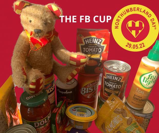 Hexham Courant: CHARITY: The Northumberland Day Bear Mascot, Northumbear, demonstrating the types of red and yellow food items that could be donated. Image: Northumberland Day