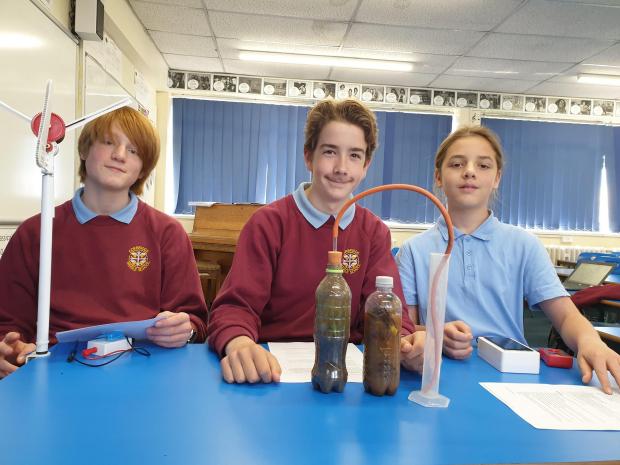 Hexham Courant: TEAM: (L-R) Joshua, Orran, and Luke with their science project. Image: Corbridge Middle School