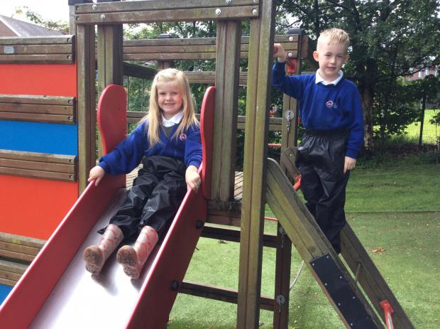 Hexham Courant: PLAY: Children at Adderlane wearing the gifted waterproof trousers