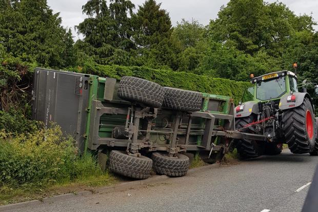 FALLEN: Police recover tipped over tractors trailer.Credit John Curry