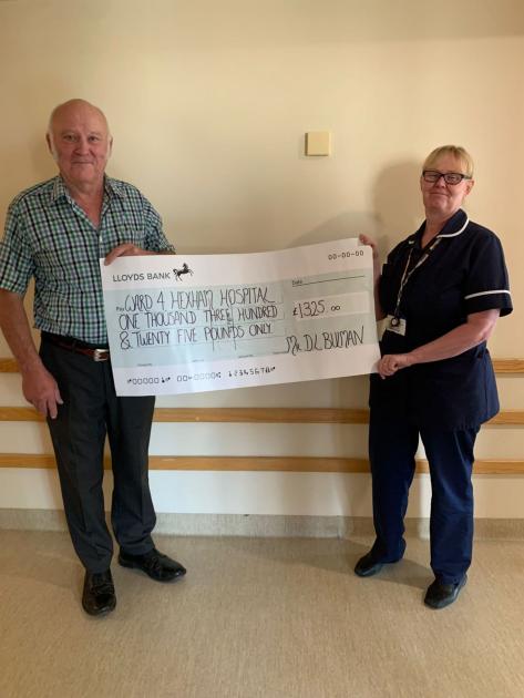 Northumberland farmer hands over cheque to Hexham Hospital 