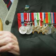 EDINBURGH, SCOTLAND - MAY 28:  An old soldier proudly shows of his campaign medals May 28, 2004 in Edinburgh, Scotland. Old soldiers of the Normandy  Veterans Association gathered at The National War Memorial, Edinburgh Castle, Scotland, to hold a