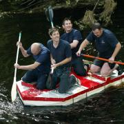 The Bellingham firefighters winning the Bellingham Raft Race in years past