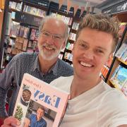 PROUD: Chris and his dad buying his first book in Hexham Waterstones