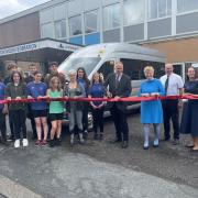 MP Dr Neil Hudson cutting the ribbon on the constituency's newest college bus service