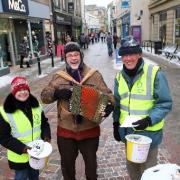 Spreading Christmas cheer and collecting for Hexham Rotary Club are from the left Roz Waller, Vic Gammon and David Robson in 2010