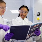 Student reads the Discovery Day booklet at a Festival of Chemistry at Heriot-Watt University