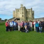 Hexham Town Twinning Association in 2017 when they hosted a successful visit from their German twin town, Metzingen. Town twinning members are pictured with their German visitors during a visit to Warkworth Castle.