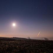 A photograph of the moon and an asteroid as it passed over Hadrian's Wall, Northumberland