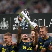 Bruno Guimaraes lifts the Sela Cup after Newcastle's wins over Fiorentina and Villarreal