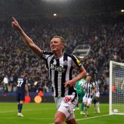 Sean Longstaff celebrates after Newcastle's third goal