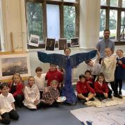 Mr Watson and pupils with the whale tail